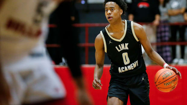 Link Academy's Tre Johnson moves the ball downcourt as the Lions took on the Central Bulldogs in The Pit at Central High School on Tuesday, Nov. 28, 2023.